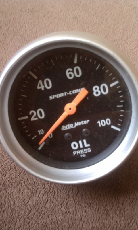 1978 Ford Bronco - An Auto Meter oil pressure gauge displays readings from 0 to 100 PSI.