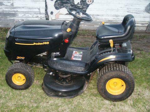 1966 Ford Bronco - This Poulan PRO riding mower features a black body with yellow accents on the wheels and deck.