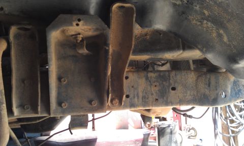 1978 Ford Bronco - Close-up of vehicle frame and suspension parts, showing rust and wear.