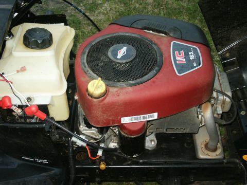 1966 Ford Bronco - Close-up of a lawnmower engine, identified as a Briggs & Stratton V-Twin 18.5 HP model.