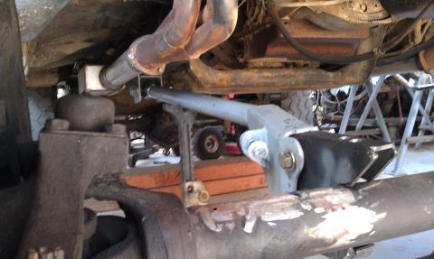 1978 Ford Bronco - Close-up view of the undercarriage, focusing on suspension and exhaust systems.