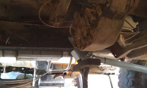 1978 Ford Bronco - A close-up view of the undercarriage reveals a large differential and exhaust system.
