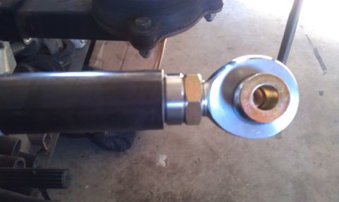 1978 Ford Bronco - A close-up view of a vehicle's suspension component, showing a rod end with hardware.