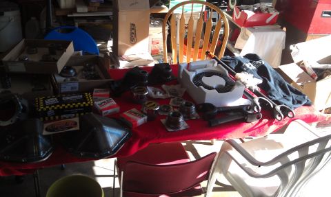 1978 Ford Bronco - Various Dana 60 differential parts are laid out on a red tablecloth, suggesting a repair or upgrade project.