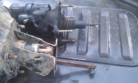 1978 Ford Bronco - Close-up of a brake booster and master cylinder assembly, likely removed from a vehicle.