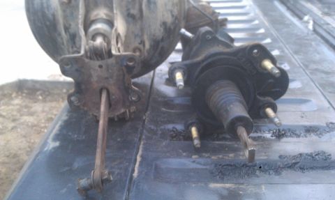 1978 Ford Bronco - Two hydroboost brake boosters are shown on a dark, textured surface.