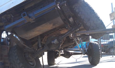 1978 Ford Bronco - This 1978 Ford Bronco is shown from an underside perspective, highlighting its lifted suspension and off-road modifications.