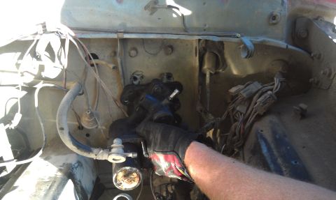 1978 Ford Bronco - Close-up view of a vehicle's engine bay, focusing on brake system components and wiring harnesses.
