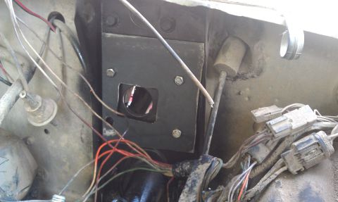 1978 Ford Bronco - Wiring harness and firewall components visible in a vehicle's engine bay.