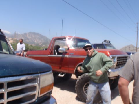 1978 Ford Bronco - A group of people and their trucks are gathered outdoors on a sunny day.