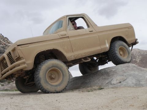 1978 Ford Bronco - This 1978 Ford Bronco navigates rocky terrain with a driver behind the wheel.