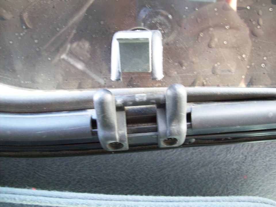 Close-up of a sunroof latch mechanism inside a vehicle