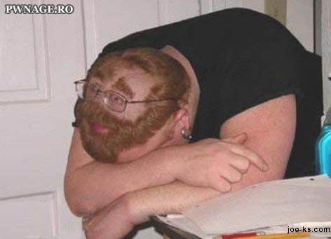 2006 Ford E350 - A person with a fake beard and hair is resting their head on their arms.