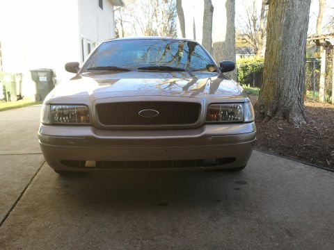 2007 Ford Crown Victoria - Front view of a 2007 Ford Crown Victoria parked on a driveway.