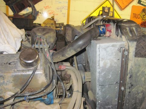 1978 Ford Bronco - Close-up view of a vehicle's engine bay, focusing on the radiator and hoses. Text from a watermark is visible.