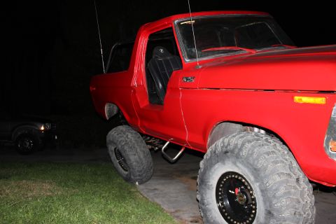 1978 Ford Bronco - This red 1978 Ford Bronco is modified with large off-road tires and lifted suspension.