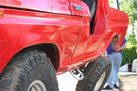 1978 Ford Bronco - 1978 Ford Bronco in red, lifted with off-road tires.