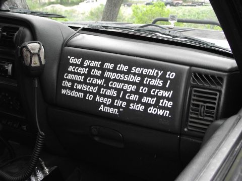 1989 Ford Bronco - A prayer for off-roading is displayed on the dashboard of a Jeep.