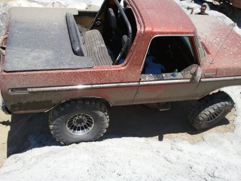 1978 Ford Bronco - This 1978 Ford Bronco is shown from a three-quarter front angle, navigating a rocky off-road course.