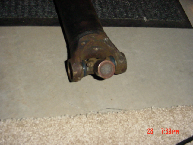 Rear driveshaft on the ground