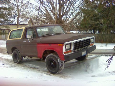 1979 Ford Bronco - This Ford Bronco has a two-tone paint job and is sitting in a snowy environment.