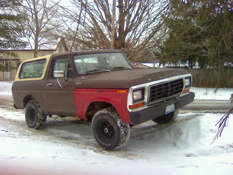 Ford Bronco with brown and red paint, parked in snow