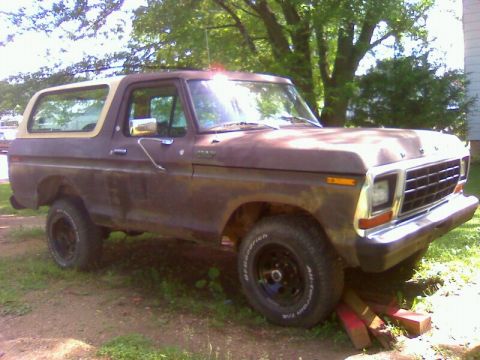 1979 Ford Bronco - This 1979 Ford Bronco, seen from a 3/4 front angle, features a brown body with a contrasting tan removable top.