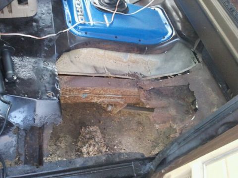 1979 Ford Bronco - The floor of this vehicle is heavily rusted and appears to be in poor condition.