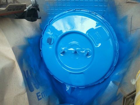 1979 Ford Bronco - A blue brake booster is shown during a painting process.