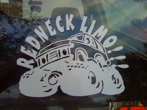 1979 Ford Bronco - A humorous sticker adorns the rear window of a vehicle, depicting a cartoon car.