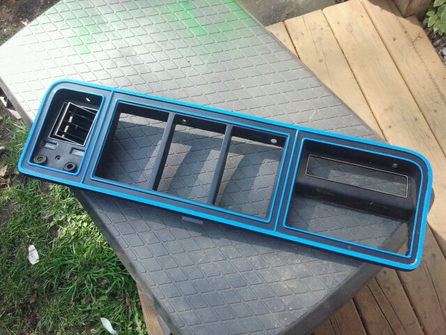 Grille assembly with blue trim and vent, likely from a Ford Bronco