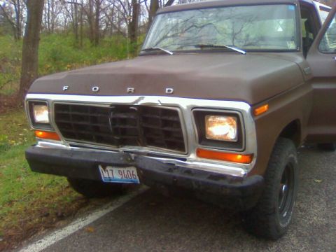 1979 Ford Bronco - This 1979 Ford Bronco shows front-end damage to its grille and bumper, with a visible license plate.