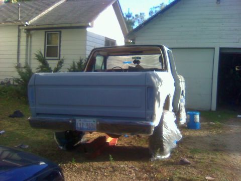 1979 Ford Bronco - This 1979 Ford Bronco is seen from the rear, with its wheels covered in plastic wrap.