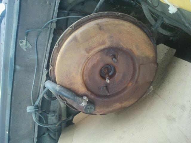 Rusty brake booster with hose attached