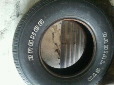 1979 Ford Bronco - A tire with "BRONCO" and "RADIAL GT" text is shown, but no vehicle is visible.