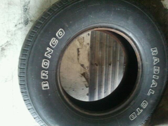 Tire with white BRONCO lettering and RADIAL GT text