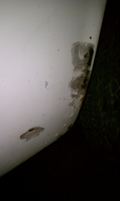 1969 Ford Mustang - Rust on passenger side quarter panel. The bondo here is maybe 3/16-1/4 inch thick. So it needs to be stripped down and evaluated at least