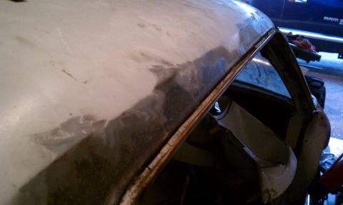 1969 Ford Mustang - This is surface rust along passenger side drip rail. There is a some pitting.