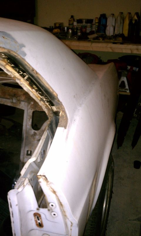 1969 Ford Mustang - Driver side quarter panel. Sorry for the bad angle its about a foot from the wall. I havent ground into it any so I am not sure if there is…