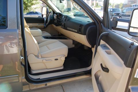 2007 GMC Sierra 1500 - The interior of a 2007 GMC Sierra 1500 pickup truck, viewed from the passenger side with the door open.