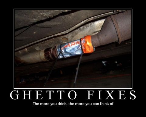 1978 Ford Bronco - A makeshift repair on a vehicle's exhaust system uses a candy bar and zip ties.
