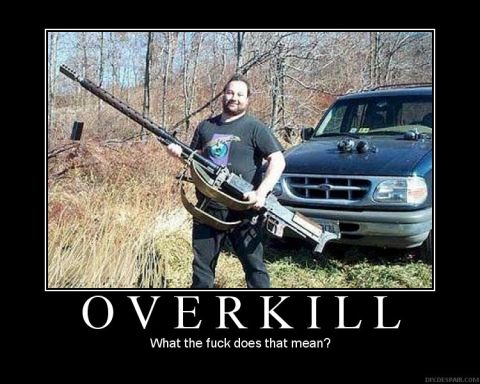 1978 Ford Bronco - A man poses with a large firearm in front of a dark-colored SUV.