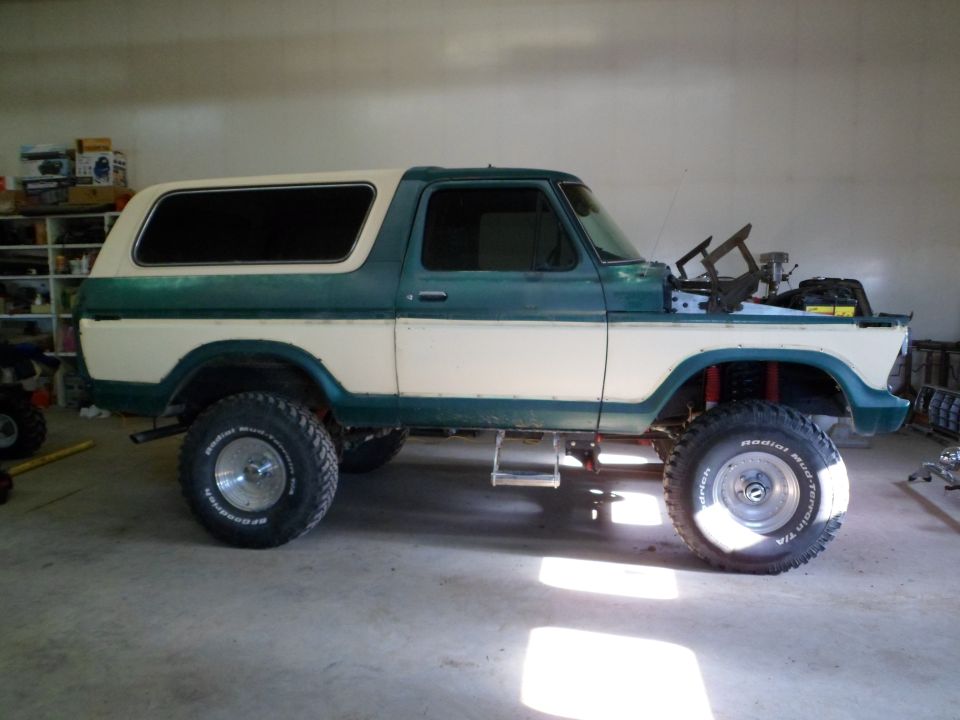 1978 Ford Bronco with two-tone paint, lifted suspension, and hood open