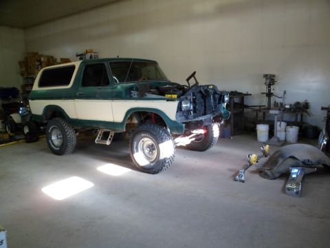 1979 Ford Bronco - This 1978 Ford Bronco is undergoing repairs in a workshop, with its front end disassembled.