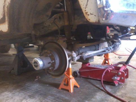 1995 Ford F-150 - The underside of a truck is shown with the front suspension and axle components visible.