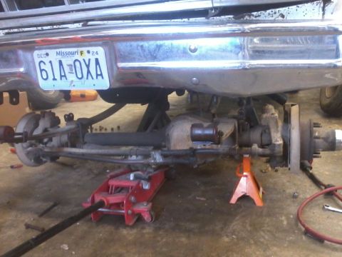 1995 Ford F-150 - The rear axle and suspension of a 1995 Ford F-150 are shown during maintenance.
