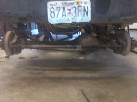 1995 Ford F-150 - Rear view of a 1995 Ford F-150 showing its axle and suspension, with a Missouri license plate visible.