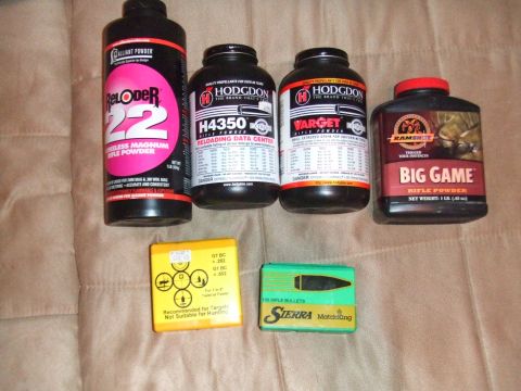 1996 Ford Bronco - Collection of rifle powder and bullets, including Hodgdon and Ramshot brands.