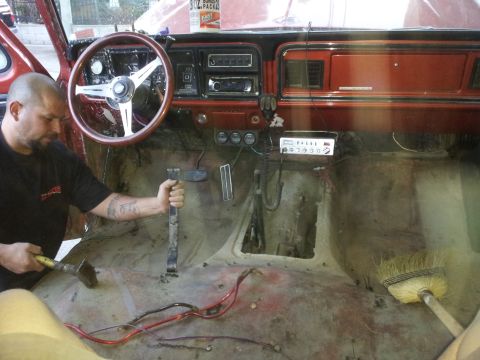 1978 Ford Bronco - Interior view of a 1978 Ford Bronco during carpet removal and repair work.