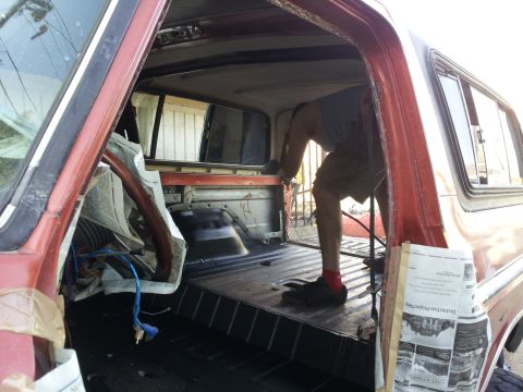 1978 Ford Bronco - Interior view of a 1978 Ford Bronco undergoing work in the cargo area.